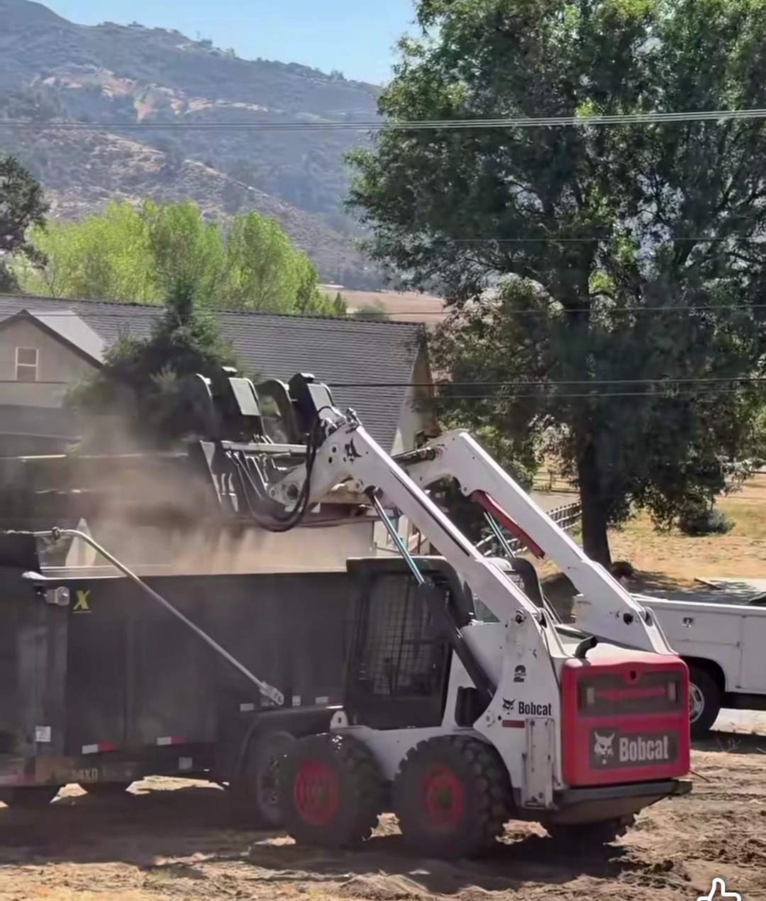 A Bobcat skid steer at work on a job site