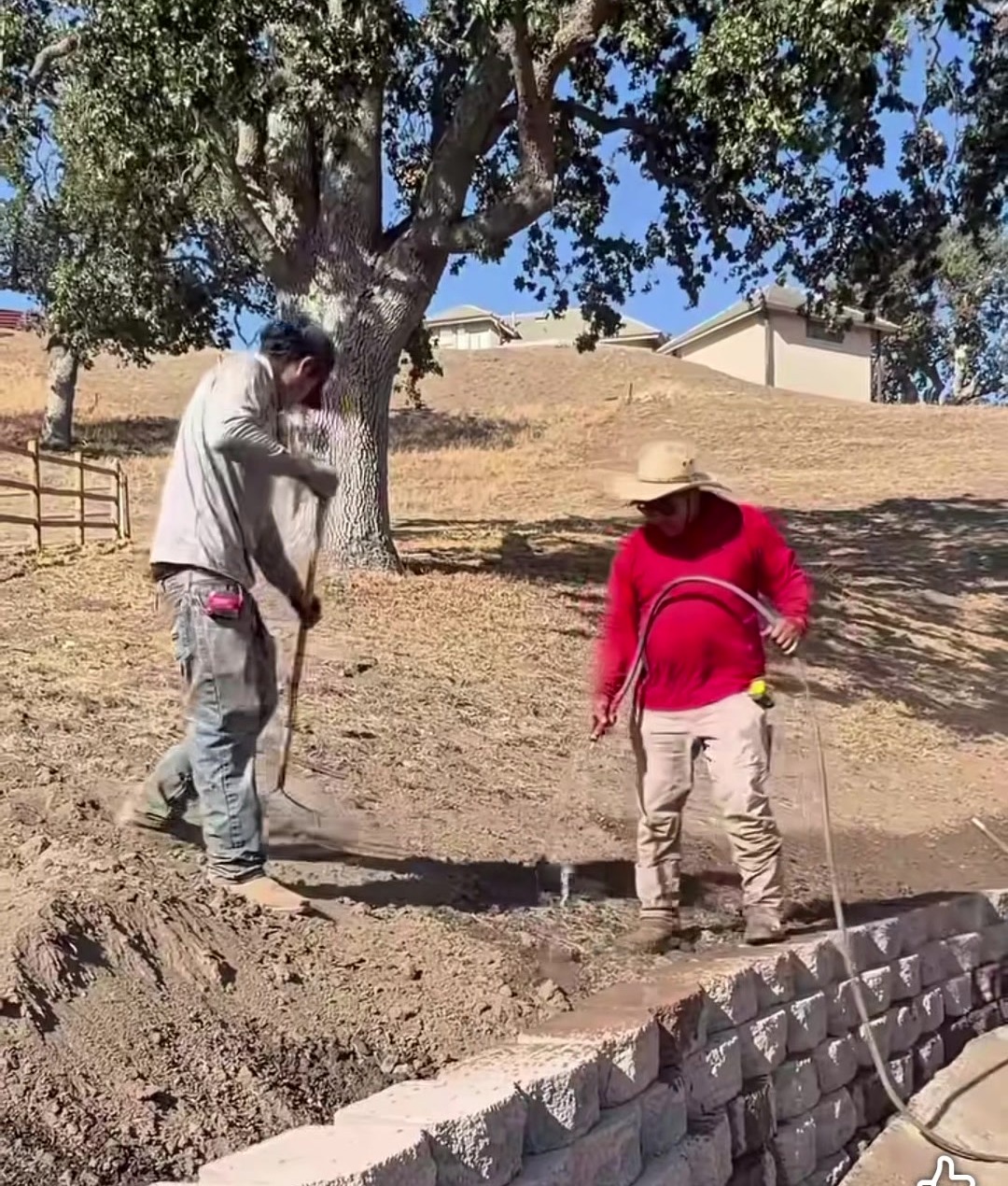 The crew building a block wall