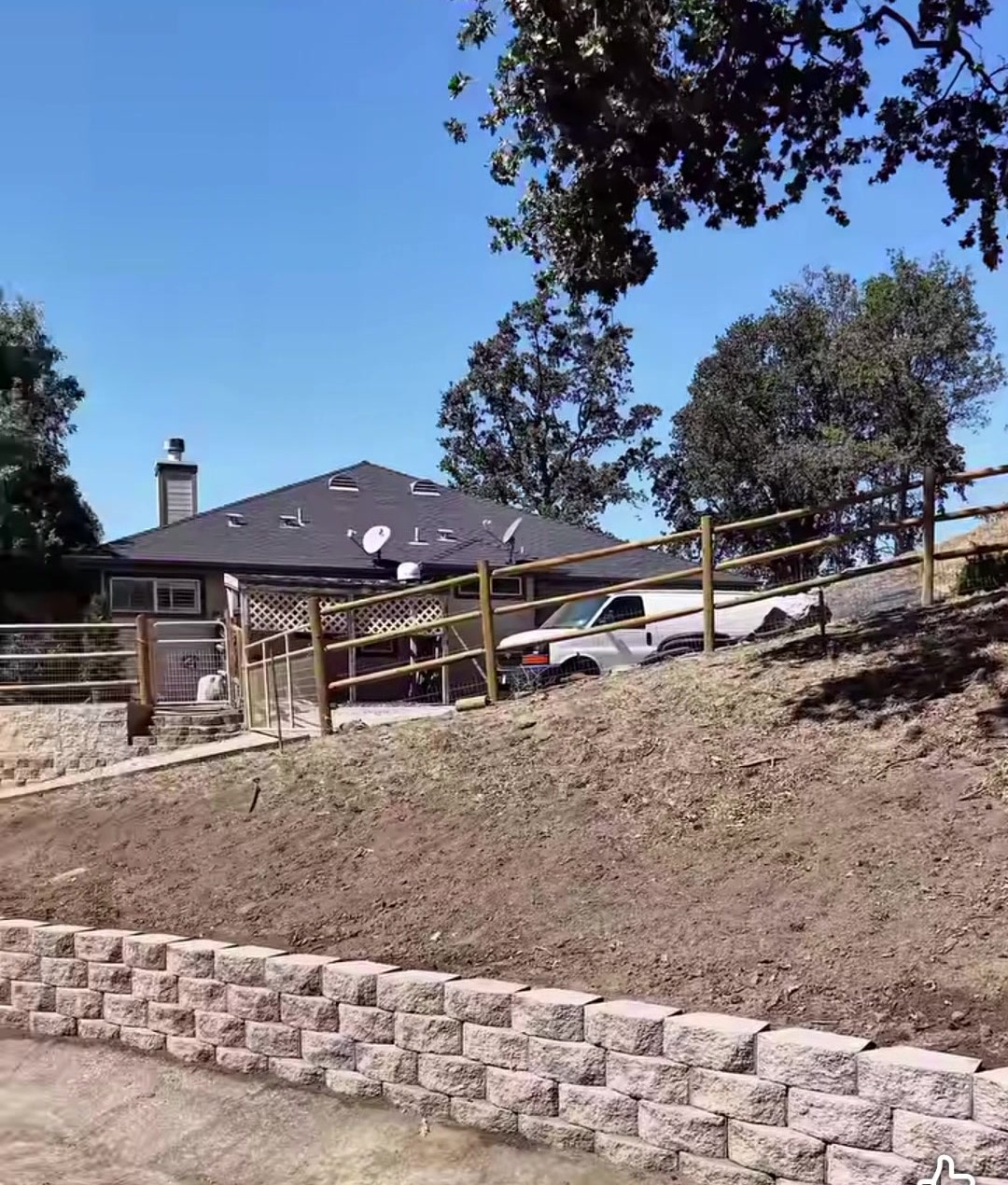 A curved retaining wall on a hillside